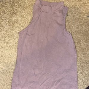 Cropped lavender high neck top.